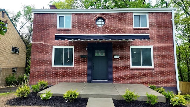 7709 Mark Dr, Penn Hills, PA 15147 - view of front facade with brick siding and a patio area