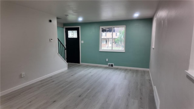 7709 Mark Dr, Penn Hills, PA 15147 - foyer with stairs, light wood-style floors, baseboards, and recessed lighting