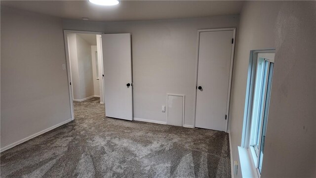 7709 Mark Dr, Penn Hills, PA 15147 - unfurnished bedroom with carpet flooring and baseboards