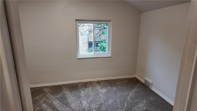 7709 Mark Dr, Penn Hills, PA 15147 - empty room featuring dark carpet, baseboards, and vaulted ceiling