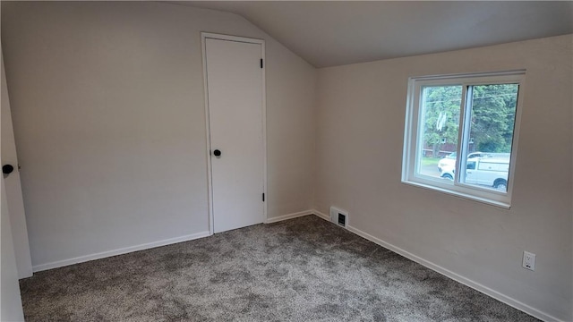 7709 Mark Dr, Penn Hills, PA 15147 - bonus room featuring vaulted ceiling, dark carpet, and baseboards
