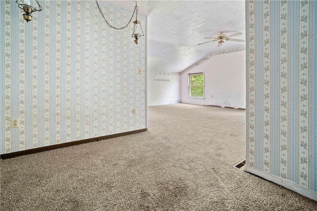 1035 Rte 130, City Of Greensburg, PA 15601 - carpeted empty room featuring lofted ceiling, a textured ceiling, a ceiling fan, and baseboards