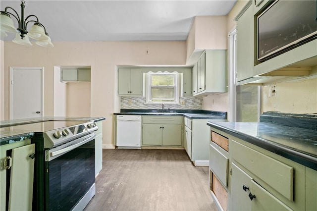 1035 Rte 130, City Of Greensburg, PA 15601 - kitchen featuring dishwasher, stainless steel electric stove, a sink, a chandelier, and light wood-style flooring