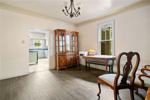 1035 Rte 130, City Of Greensburg, PA 15601 - living area with wood finished floors, a chandelier, and baseboards