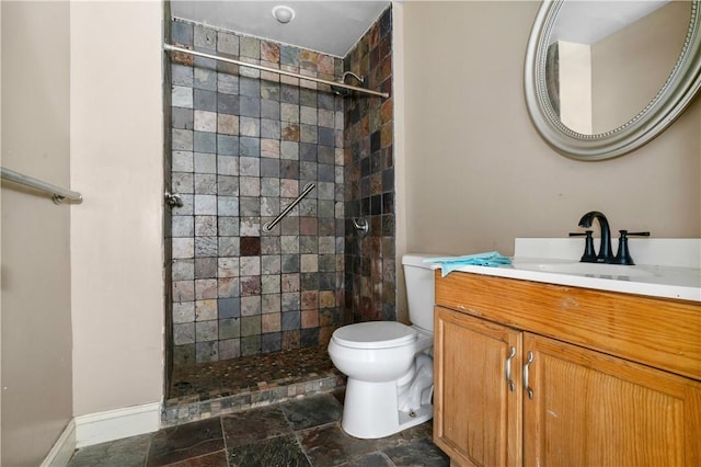 1035 Rte 130, City Of Greensburg, PA 15601 - full bathroom with tiled shower, stone finish floors, toilet, vanity, and baseboards