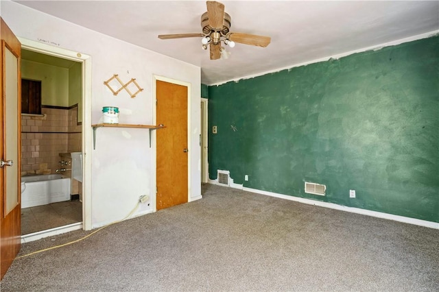 1035 Rte 130, City Of Greensburg, PA 15601 - unfurnished bedroom with carpet flooring, baseboards, a ceiling fan, and connected bathroom