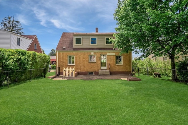 back of property featuring entry steps, brick siding, and a gate