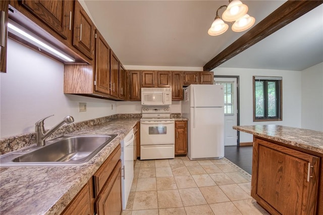 kitchen with white appliances, a sink, and light tile patterned floors