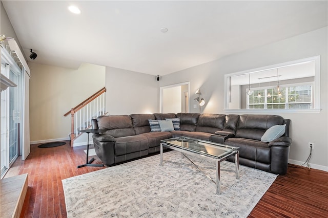 living area featuring hardwood / wood-style flooring, baseboards, stairway, and recessed lighting