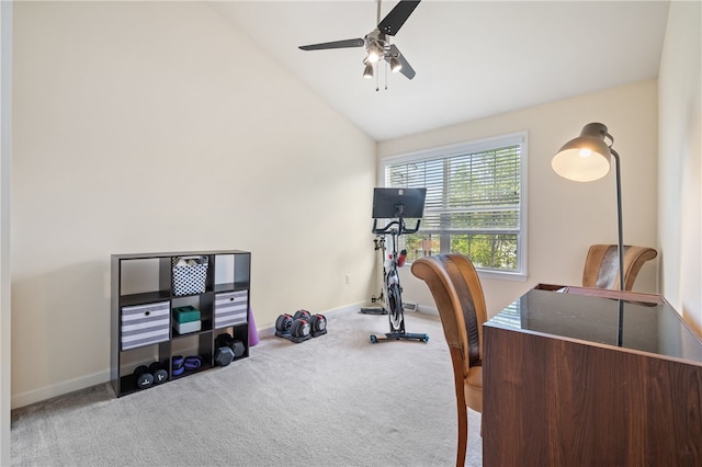 carpeted office with a ceiling fan, vaulted ceiling, and baseboards