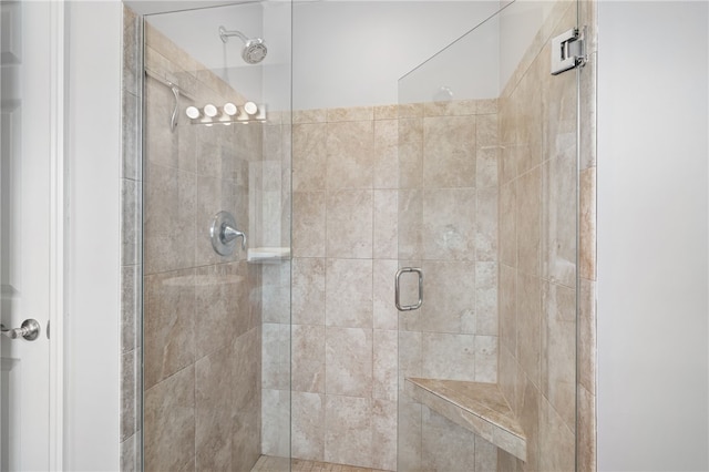 full bath with a shower stall