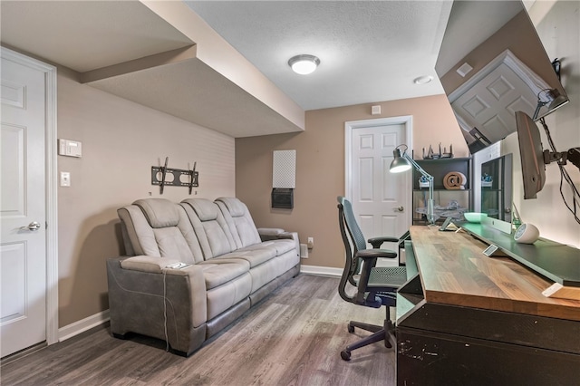 office area with wood finished floors and baseboards