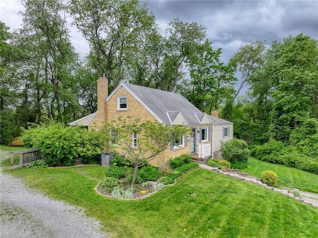140 8th Ave, Ross Twp, PA 15229 - view of front facade with a chimney, a front yard, and brick siding