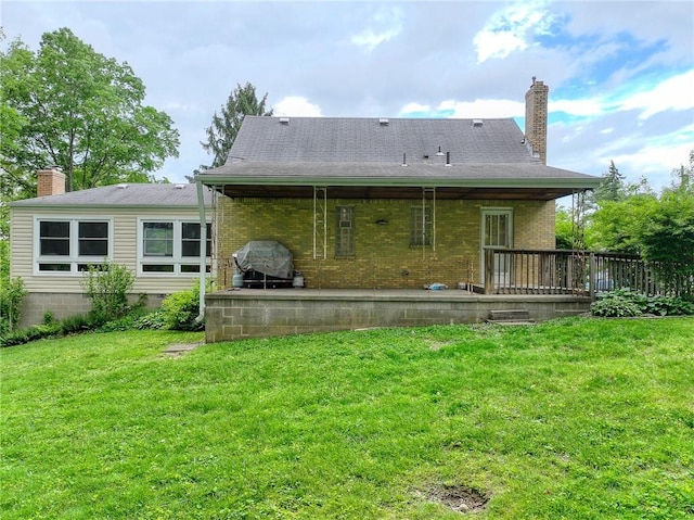 140 8th Ave, Ross Twp, PA 15229 - back of property with a chimney, brick siding, and a lawn