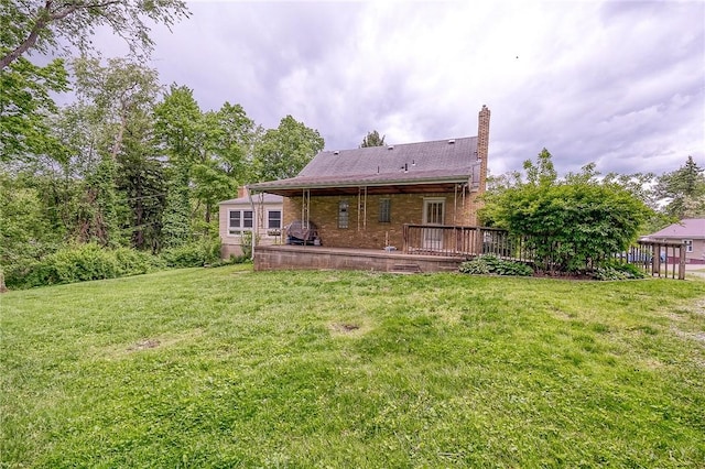 140 8th Ave, Ross Twp, PA 15229 - rear view of property with a yard, a chimney, a deck, and brick siding