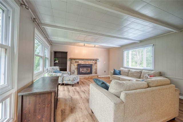 140 8th Ave, Ross Twp, PA 15229 - living area featuring wood finished floors, healthy amount of natural light, rail lighting, beamed ceiling, and wood walls