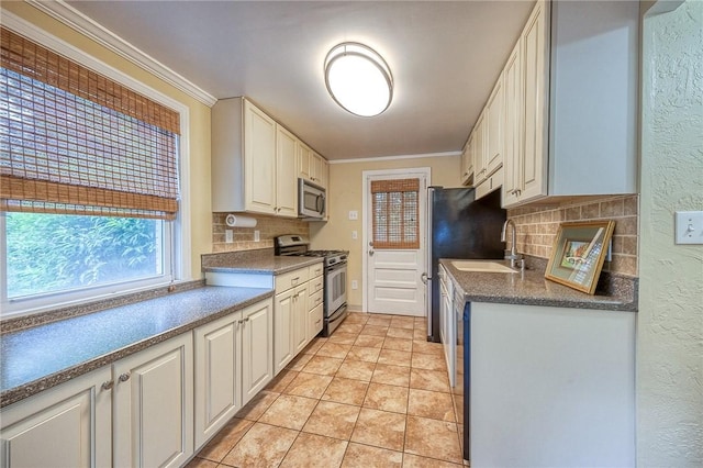 140 8th Ave, Ross Twp, PA 15229 - kitchen featuring appliances with stainless steel finishes, tasteful backsplash, crown molding, a sink, and light tile patterned floors