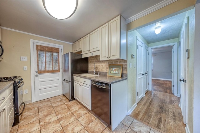 140 8th Ave, Ross Twp, PA 15229 - kitchen with appliances with stainless steel finishes, crown molding, tasteful backsplash, a sink, and white cabinetry