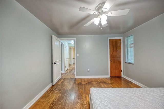 140 8th Ave, Ross Twp, PA 15229 - unfurnished bedroom featuring wood finished floors, baseboards, and ceiling fan