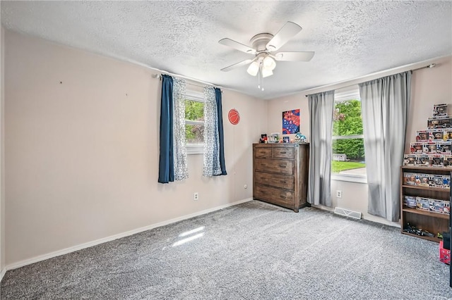 1370 Coronado Dr, Hermitage, PA 16148 - bedroom with a textured ceiling, carpet, baseboards, and ceiling fan