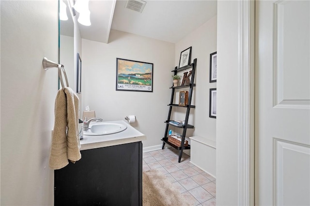 bathroom with tile patterned floors and vanity