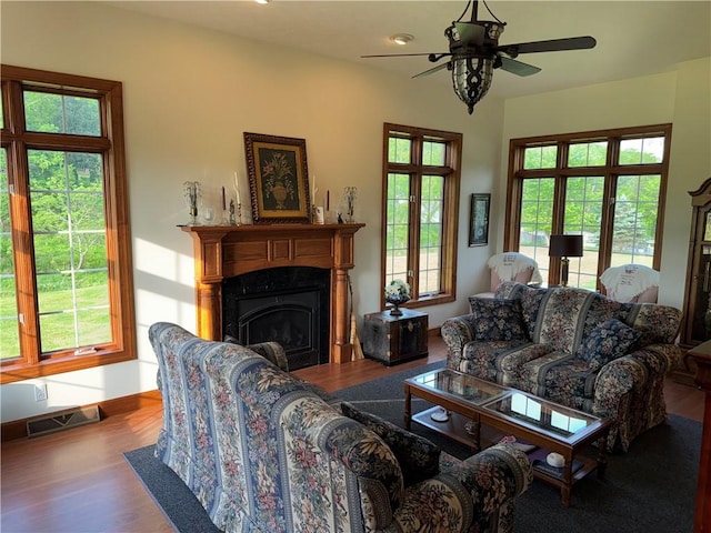 16 Finnin Rd, Allegheny Twp Wml, PA 15068 - living room with wood finished floors, ceiling fan, a fireplace, and baseboards