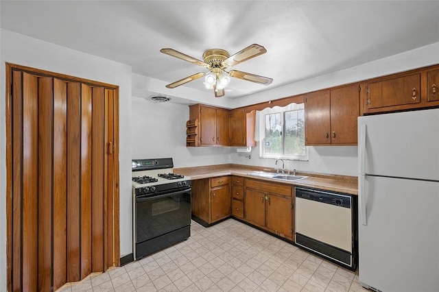 kitchen featuring white appliances, a sink, a ceiling fan, and brown cabinetry