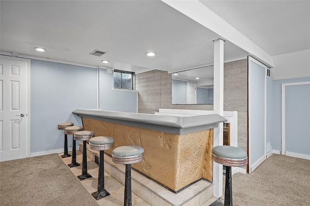 indoor dry bar featuring baseboards, recessed lighting, and carpet floors
