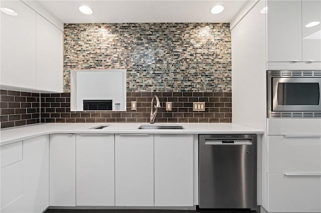 3413 Ridgewood Dr, Churchill Boro, PA 15235 - kitchen with stainless steel appliances, modern cabinets, white cabinets, a sink, and light countertops