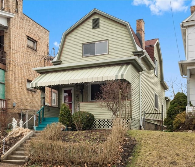 816 E 11th Ave, Munhall, PA 15120 - dutch colonial with a gambrel roof and covered porch
