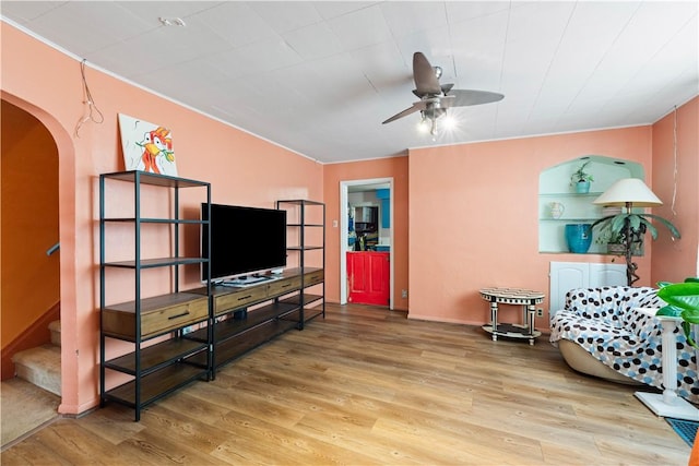816 E 11th Ave, Munhall, PA 15120 - living area with a ceiling fan, wood finished floors, arched walkways, and stairway