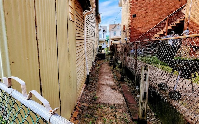 816 E 11th Ave, Munhall, PA 15120 - view of property exterior featuring fence and central air condition unit