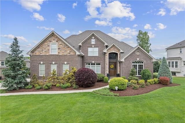 347 Buckingham Dr, Peters Twp, PA 15367 - view of front of property featuring brick siding, a front lawn, and stone siding