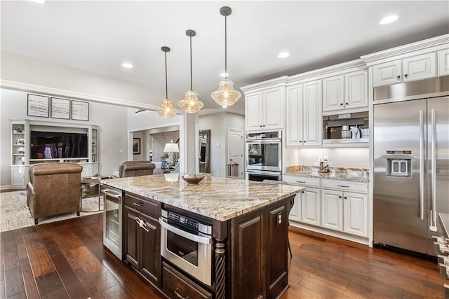 347 Buckingham Dr, Peters Twp, PA 15367 - kitchen featuring appliances with stainless steel finishes, wine cooler, white cabinets, dark wood-style flooring, and dark brown cabinets