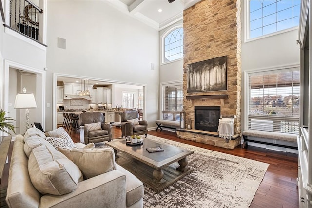 347 Buckingham Dr, Peters Twp, PA 15367 - living area featuring a fireplace, a high ceiling, dark wood finished floors, beamed ceiling, and ornamental molding