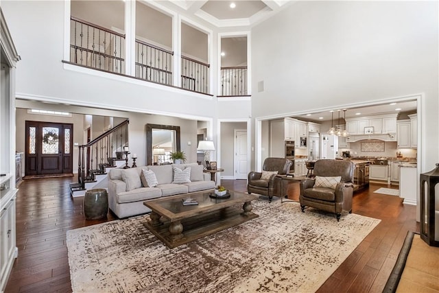 347 Buckingham Dr, Peters Twp, PA 15367 - living room with a towering ceiling, dark wood-style floors, coffered ceiling, stairway, and beam ceiling