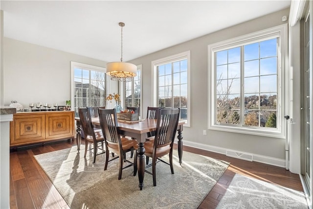 347 Buckingham Dr, Peters Twp, PA 15367 - dining space featuring a chandelier, dark wood finished floors, and baseboards