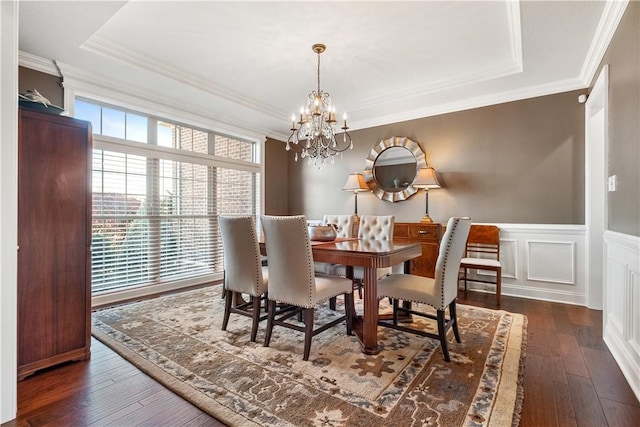 347 Buckingham Dr, Peters Twp, PA 15367 - dining space featuring dark wood-style floors, a chandelier, a raised ceiling, a wainscoted wall, and crown molding