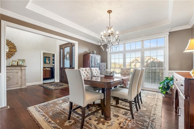 347 Buckingham Dr, Peters Twp, PA 15367 - dining space with a chandelier, a tray ceiling, hardwood / wood-style floors, and crown molding