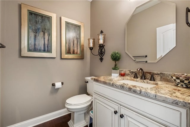 347 Buckingham Dr, Peters Twp, PA 15367 - half bath featuring baseboards, wood finished floors, toilet, and vanity