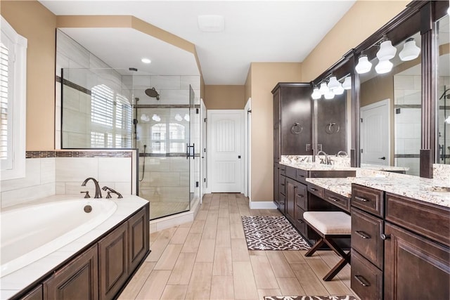 347 Buckingham Dr, Peters Twp, PA 15367 - full bath featuring a shower stall, vanity, a bath, and wood finished floors