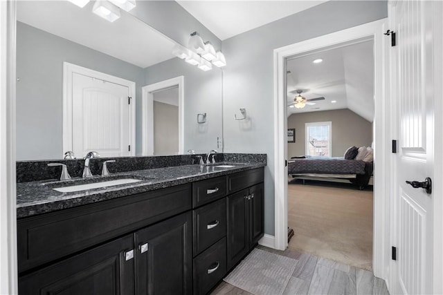 347 Buckingham Dr, Peters Twp, PA 15367 - bathroom featuring ceiling fan, ensuite bath, double vanity, lofted ceiling, and baseboards