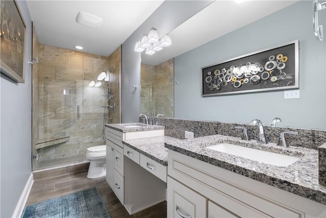 347 Buckingham Dr, Peters Twp, PA 15367 - full bathroom with double vanity, a stall shower, toilet, wood finished floors, and recessed lighting