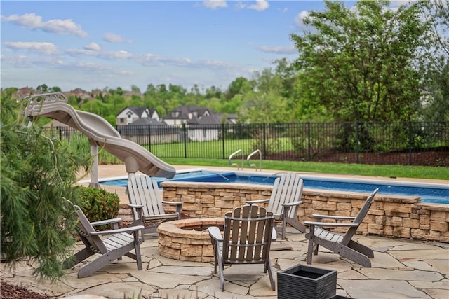 347 Buckingham Dr, Peters Twp, PA 15367 - view of swimming pool featuring a water slide, a fire pit, fence, a patio, and a jacuzzi