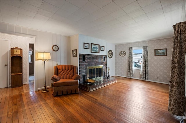3601 Sharon Rd, West Middlesex Boro, PA 16159 - living area featuring hardwood / wood-style flooring, a fireplace, wallpapered walls, and baseboards
