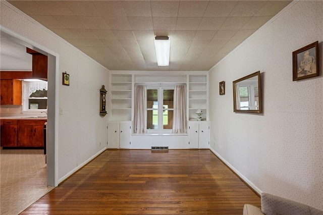 3601 Sharon Rd, West Middlesex Boro, PA 16159 - unfurnished room with hardwood / wood-style floors, ornamental molding, built in shelves, wallpapered walls, and baseboards