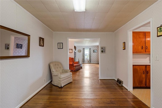 3601 Sharon Rd, West Middlesex Boro, PA 16159 - hallway with ornamental molding, wallpapered walls, and hardwood / wood-style flooring