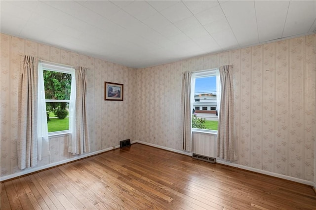 3601 Sharon Rd, West Middlesex Boro, PA 16159 - empty room featuring hardwood / wood-style floors, healthy amount of natural light, and baseboards