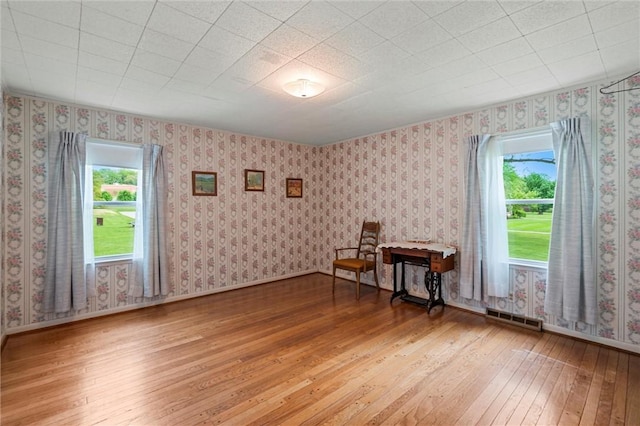 3601 Sharon Rd, West Middlesex Boro, PA 16159 - spare room featuring light wood-style floors, plenty of natural light, baseboards, and wallpapered walls