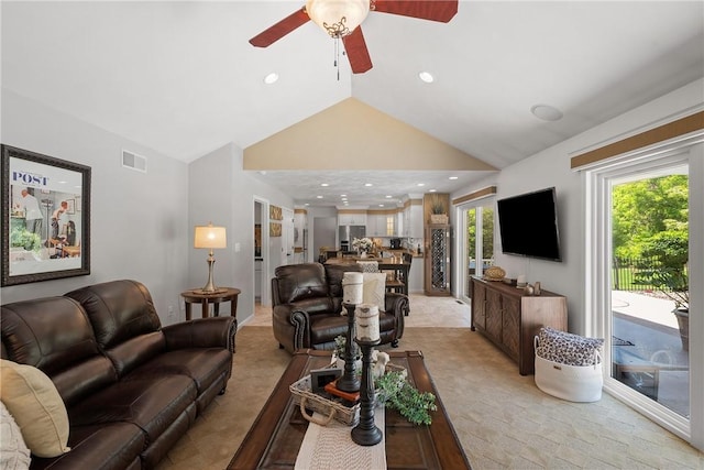 living area featuring lofted ceiling, a ceiling fan, light carpet, and recessed lighting